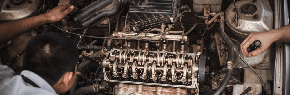 mechanic inspecting car engine